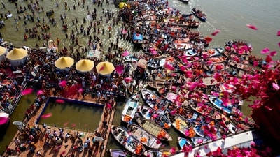 Government officials shower flower petals from a helicopter onto pilgrims gathered at the Sangam, the confluence of three rivers, the Ganges, the Yamuna and the mythical Saraswati, on Maghi Purnima or the full-moon day during the Maha Kumbh festival in Prayagraj. (AP) Government officials shower flower petals from a helicopter onto pilgrims gathered at the Sangam, the confluence of three rivers, the Ganges, the Yamuna and the mythical Saraswati, on Maghi Purnima or the full-moon day during the Maha Kumbh festival in Prayagraj. (AP)