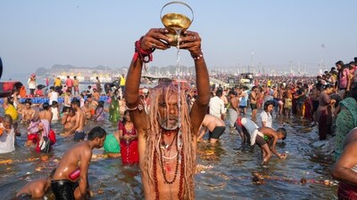 Devotees perform rituals while taking a holy dip at the Sangam on the occasion of 'Maghi Purnima' during the ongoing Maha Kumbh Mela, in Prayagraj. (PTI) Devotees perform rituals while taking a holy dip at the Sangam on the occasion of 'Maghi Purnima' during the ongoing Maha Kumbh Mela, in Prayagraj. (PTI)