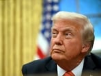 Donald Trump speaks to the press after signing an executive order in the Oval Office of the White House in Washington, DC, on February 10.