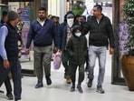 Security personnel escort Indian immigrants deported from the U.S., as they leave the airport in Ahmedabad, India. (file)