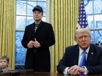 US President Donald Trump speaks next to Elon Musk and X Æ A-12, Musk's son, in the Oval Office of the White House in Washington.