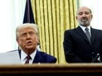 US President Donald Trump speaks from the Oval Office of the White House, flanked by US Commerce secretary Howard Lutnick, on the day he signs executive orders for reciprocal tariffs, in Washington, DC on February 13, 2025