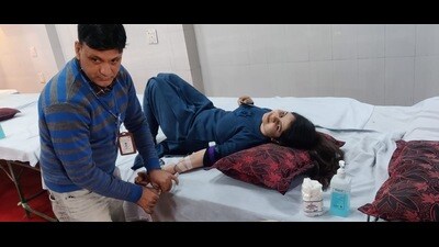 A volunteer donating blood during a blood camp at Radha Madhav Temple, Sector 4, in Panchkula on February 11. (HT Photo)