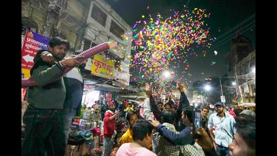 Locals greet and celebrate with devotees as they proceed to their destination at Nakhas Kona area late at night following the Maghi Purnima sacred bath of the Mahakumbh (PTI) Locals greet and celebrate with devotees as they proceed to their destination at Nakhas Kona area late at night following the Maghi Purnima sacred bath of the Mahakumbh (PTI)