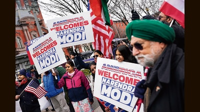 People hold placards welcoming PM Modi to the US, near the White House on Thursday. (REUTERS) People hold placards welcoming PM Modi to the US, near the White House on Thursday. (REUTERS)