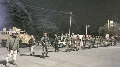 Security personnel stand guard in Imphal hours after President’s Rule was imposed in Manipur. (PTI)