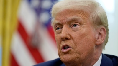 President Donald Trump speaks to reporters after signing an executive order in the Oval Office of the White House, Thursday, Feb. 13, 2025, in Washington. (AP Photo/Ben Curtis) (AP)