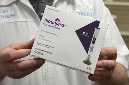 FILE PHOTO: A pharmacist displays a box of Mounjaro, a tirzepatide injection drug used for treating type 2 diabetes made by Lilly at Rock Canyon Pharmacy in Provo, Utah, U.S. March 29, 2023. REUTERS/George Frey/File Photo (REUTERS)