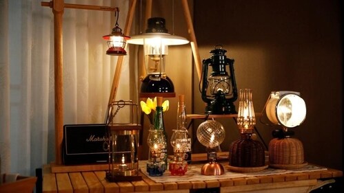Various types of mini portable lamps are seen on a table to recreate the outdoor camping effect. (Image by Kim Hong-Ji / REUTERS) Various types of mini portable lamps are seen on a table to recreate the outdoor camping effect. (Image by Kim Hong-Ji / REUTERS)