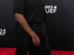 Kanye West's Super Bowl ad promoting Yeezy apparel took a controversial turn when he replaced items with a T-shirt featuring a swastika and the legal expert believes he may avoid consequences.