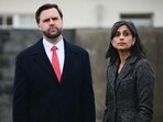 US Vice President JD Vance (L) stands with his wife Usha Vance as they take part in a tour of the Dachau Concentration Camp memorial site in Dachau. (Photo by Tobias SCHWARZ / AFP)
