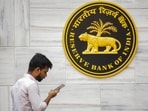 A man walks past the RBI logo at RBI headquarters in Mumbai, Friday, Feb. 7, 2025. A man walks past the RBI logo at RBI headquarters in Mumbai, Friday, Feb. 7, 2025.