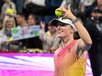 Poland's Iga Swiatek gestures after winning against Kazakhstan's Elena Rybakina.