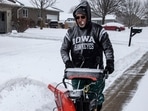 Rick Boland uses a snowblower to clear snow from his driveway in North Liberty, Iowa, Wednesday, February. 12, 2025. Rick Boland uses a snowblower to clear snow from his driveway in North Liberty, Iowa, Wednesday, February. 12, 2025.