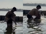 A man’s beagle joined him for a holy dip at Mahakumbh.