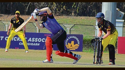 Players in action during the Chandrashekhar Azad T20 tournament at Tau Devi Lal Stadium in Panchkula on Friday. (Sant Arora/HT)