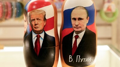 Traditional Russian wooden nesting dolls, Matryoshka dolls, depicting Russia's President Vladimir Putin (R), US President Donald Trump, and his wife Melania (L) are displayed for sale at a gift shop on the touristic Arbat street in downtown Moscow on February 13, 2025. (AFP)