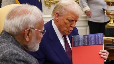 US President Donald Trump gifts Prime Minister Narendra Modi a coffee table book ‘Our Journey Together’. (narendramodi-X) US President Donald Trump gifts Prime Minister Narendra Modi a coffee table book ‘Our Journey Together’. (narendramodi-X)