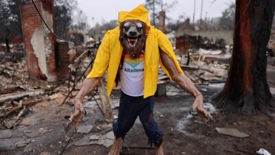 A warewolf was dressed and positioned near the location of a neighborhood in Altadena, California, as residents in southern California have been asked to evacuate their homes. (AFP) A warewolf was dressed and positioned near the location of a neighborhood in Altadena, California, as residents in southern California have been asked to evacuate their homes. (AFP)