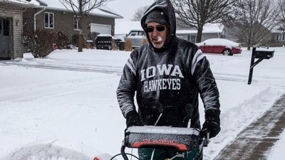 Rick Boland uses a snowblower to clear snow from his driveway in North Liberty, Iowa, Wednesday, February. 12, 2025. (AP) Rick Boland uses a snowblower to clear snow from his driveway in North Liberty, Iowa, Wednesday, February. 12, 2025. (AP)