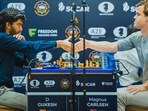D Gukesh and Magnus Carlsen after a game. D Gukesh and Magnus Carlsen after a game.