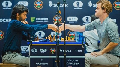 D Gukesh and Magnus Carlsen after a game. D Gukesh and Magnus Carlsen after a game.