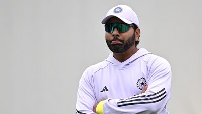 Rohit Sharma watches teammates during a practice session (AFP) Rohit Sharma watches teammates during a practice session (AFP)