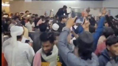 A viral video of men jumping over automated fare collection gates at the Jama Masjid metro station. (Screengrab from viral video) A viral video of men jumping over automated fare collection gates at the Jama Masjid metro station. (Screengrab from viral video)