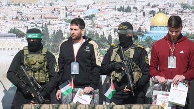 U.S.-Israeli Sagui Dekel-Chen and Russian-Israeli Sasha (Alexander) Troufanov, hostages held in Gaza since the deadly October 7, 2023 attack, are released by Palestinian Hamas and Islamic Jihad militants as part of a ceasefire and a hostages-prisoners swap deal between Hamas and Israel. (Reuters)