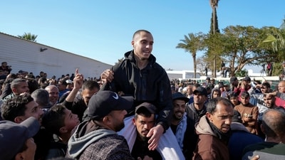 A freed Palestinian prisoner is greeted by a crowd in Khan Younis, Gaza Strip, Saturday, Feb. 15, 2025, as he arrive in the Gaza Strip after being released from an Israeli prison following a ceasefire agreement between Hamas and Israel. (AP Photo/Abdel Kareem Hana) (AP) A freed Palestinian prisoner is greeted by a crowd in Khan Younis, Gaza Strip, Saturday, Feb. 15, 2025, as he arrive in the Gaza Strip after being released from an Israeli prison following a ceasefire agreement between Hamas and Israel. (AP Photo/Abdel Kareem Hana) (AP)