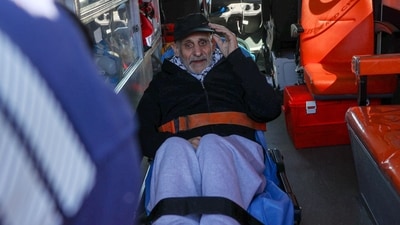 Upon arriving in the occupied West Bank city of Ramallah on February 15, 2025, a former Palestinian prisoner is assisted into an ambulance before being transferred to a nearby hospital. He was one of four prisoners released as part of the ongoing truce in Gaza, with medical care awaiting them after their release.&nbsp;(Photo by Zain JAAFAR / AFP) (AFP)