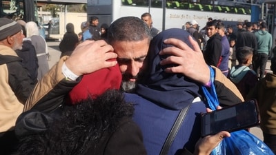 After years of separation, a former Palestinian prisoner, released in the sixth hostage-prisoner exchange, is welcomed with emotional embraces by his family upon his arrival at the European Hospital in Khan Yunis, southern Gaza Strip, on February 15, 2025. (Photo by Eyad BABA / AFP) (AFP)