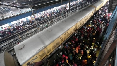Heavy rush of passengers to catch a train for Mahakumbh, at the New Delhi railway station (PTI) Heavy rush of passengers to catch a train for Mahakumbh, at the New Delhi railway station (PTI)
