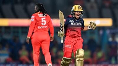 RCB's Kanika Ahuja celebrates her team's win over GG in the WPL opener on Friday. (AFP) RCB's Kanika Ahuja celebrates her team's win over GG in the WPL opener on Friday. (AFP)