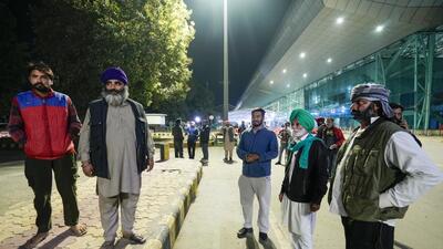 Relatives of the deportees wait outside the airport in Amritsar on Saturday. (PTI) Relatives of the deportees wait outside the airport in Amritsar on Saturday. (PTI)