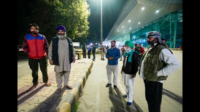Relatives wait outside the airport ahead of the second batch of the immigrants' arrival from the US in Amritsar on Saturday (PTI) Relatives wait outside the airport ahead of the second batch of the immigrants' arrival from the US in Amritsar on Saturday (PTI)