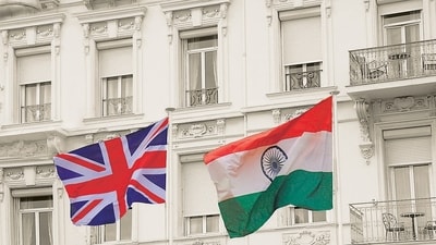 UK Great Britain and India national flag waving in the wind from flagpoles in front of a white mansion. (Shutterstock) UK Great Britain and India national flag waving in the wind from flagpoles in front of a white mansion. (Shutterstock)