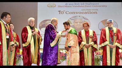 Vice-President Jagdeep Dhankhar awarding a medal to a student as his wife Sudesh, Jammu and Kashmir lieutenant governor Manoj Sinha, and chief minister Omar Abdullah look on during the 10th convocation of the Shri Mata Vaishno Devi University at Katra in Reasi district on Saturday. (PTI Photo)