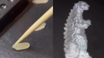 A jeweller from Russia crafted a detailed Godzilla sculpture from a tiny 0.3-inch grain of rice. (Instagram/retroscifiart) A jeweller from Russia crafted a detailed Godzilla sculpture from a tiny 0.3-inch grain of rice. (Instagram/retroscifiart)