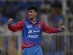 Afghanistan's Mujeeb Ur Rahman celebrates after taking a wicket.