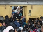 People board an overcrowded train for Prayagraj's Mahakumbh, at the New Delhi railway station. People board an overcrowded train for Prayagraj's Mahakumbh, at the New Delhi railway station.