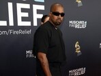 After confusion at the Grammys, Kanye West admits he spent hours trying to get tickets, ultimately securing access to the red carpet.

 Frazer Harrison/Getty Images/AFP 