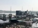 Trash Skimmer conducts a cleaning operation of Yamuna River, in New Delhi on Sunday. Trash Skimmer conducts a cleaning operation of Yamuna River, in New Delhi on Sunday.