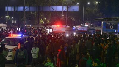 Emergency services arrive at the railway station and make their way towards the entrance amid crowds of passengers. (HT Photo) Emergency services arrive at the railway station and make their way towards the entrance amid crowds of passengers. (HT Photo)