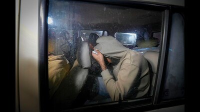 Indians deported from the US being escorted by the police as they leave the airport after their arrival, in Amritsar, early Sunday. (PTI) Indians deported from the US being escorted by the police as they leave the airport after their arrival, in Amritsar, early Sunday. (PTI)