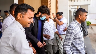 Ahmedabad: Police escort immigrants deported from the U.S. upon their arrival at Ahmedabad airport, in Ahmedabad, Sunday, Feb. 16, 2025. They had landed in Amritsar a day earlier on a U.S. military plane. (PTI) Ahmedabad: Police escort immigrants deported from the U.S. upon their arrival at Ahmedabad airport, in Ahmedabad, Sunday, Feb. 16, 2025. They had landed in Amritsar a day earlier on a U.S. military plane. (PTI)