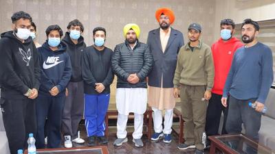 The second batch of US deportees with Punjab cabinet minister Kuldeep Singh Dhaliwal and Harbhajan Singh ETO in Amritsar on Sunday. (HT Photo) The second batch of US deportees with Punjab cabinet minister Kuldeep Singh Dhaliwal and Harbhajan Singh ETO in Amritsar on Sunday. (HT Photo)