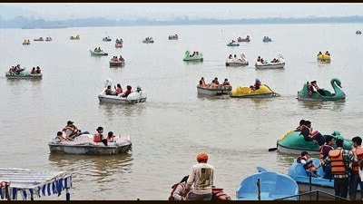 Visitors enjoying boating at Sukhna Lake on a cloudy Sunday. (Keshav Singh/HT)