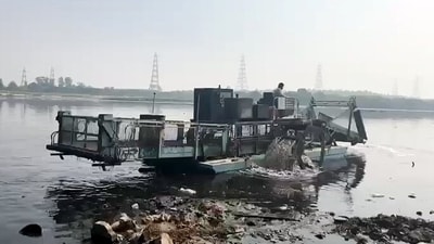 Trash Skimmer conducts a cleaning operation of Yamuna River, in New Delhi on Sunday. (ANI) Trash Skimmer conducts a cleaning operation of Yamuna River, in New Delhi on Sunday. (ANI)