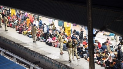 Police personnel managing passengers following a stampede at New Delhi Railway Station due to overcrowding caused by devotees heading to Prayagraj, in New Delhi on Saturday. (ANI) Police personnel managing passengers following a stampede at New Delhi Railway Station due to overcrowding caused by devotees heading to Prayagraj, in New Delhi on Saturday. (ANI)